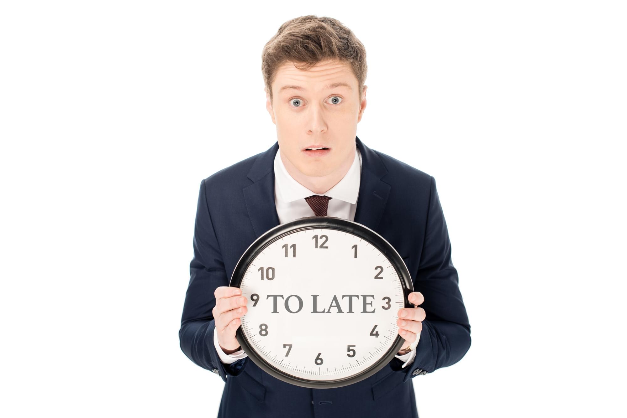shocked-businessman-holding-clock-with-to-late-le-2023-11-27-05-26-23-utc